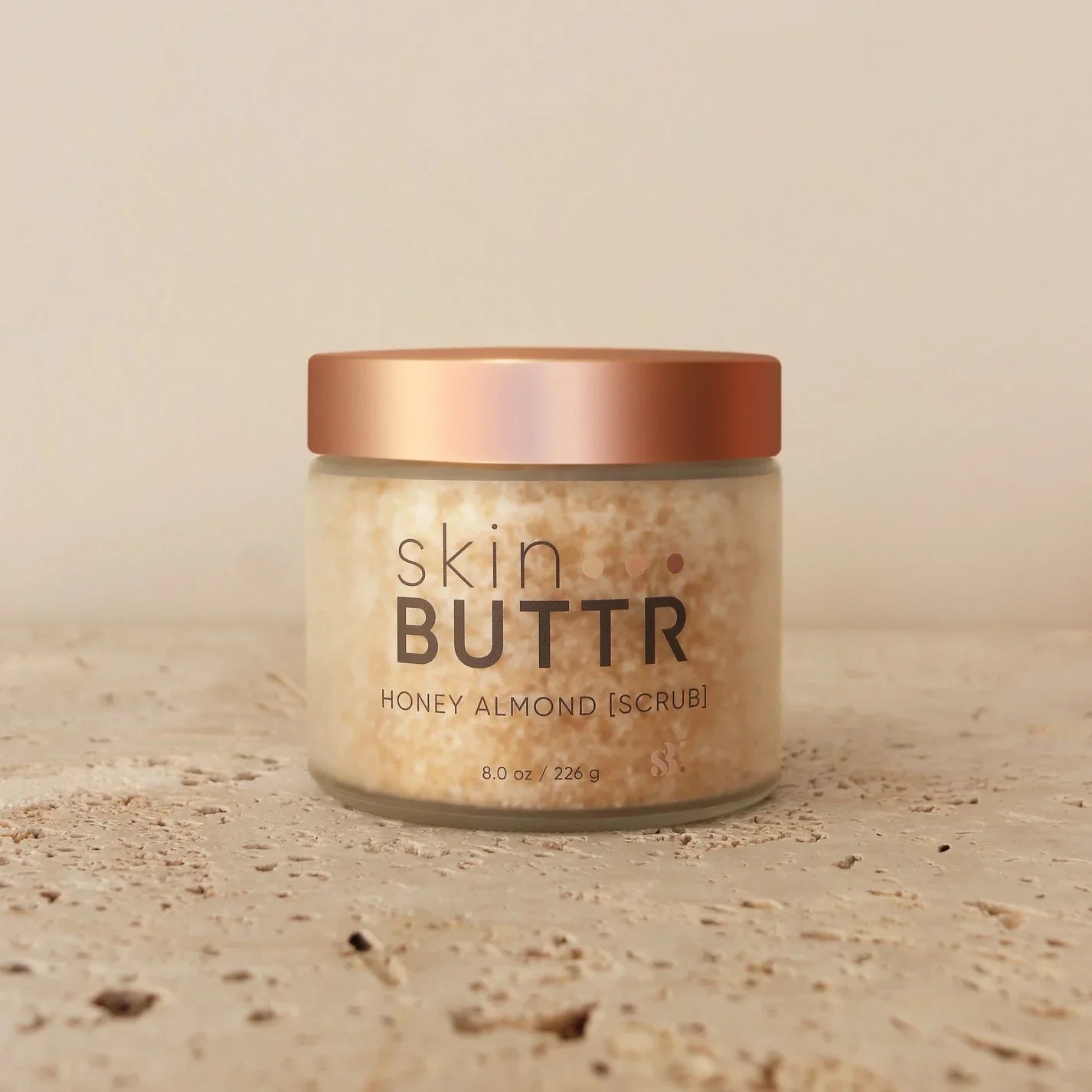 oney Almond Scrub in jar – exfoliating body scrub with sugar blend
Texture of Honey Almond Scrub – creamy sugar body polish
Applying scrub to arm – honey almond scented exfoliating treatment
Product shot with honey dipper and almonds – natural body scrub aesthetic