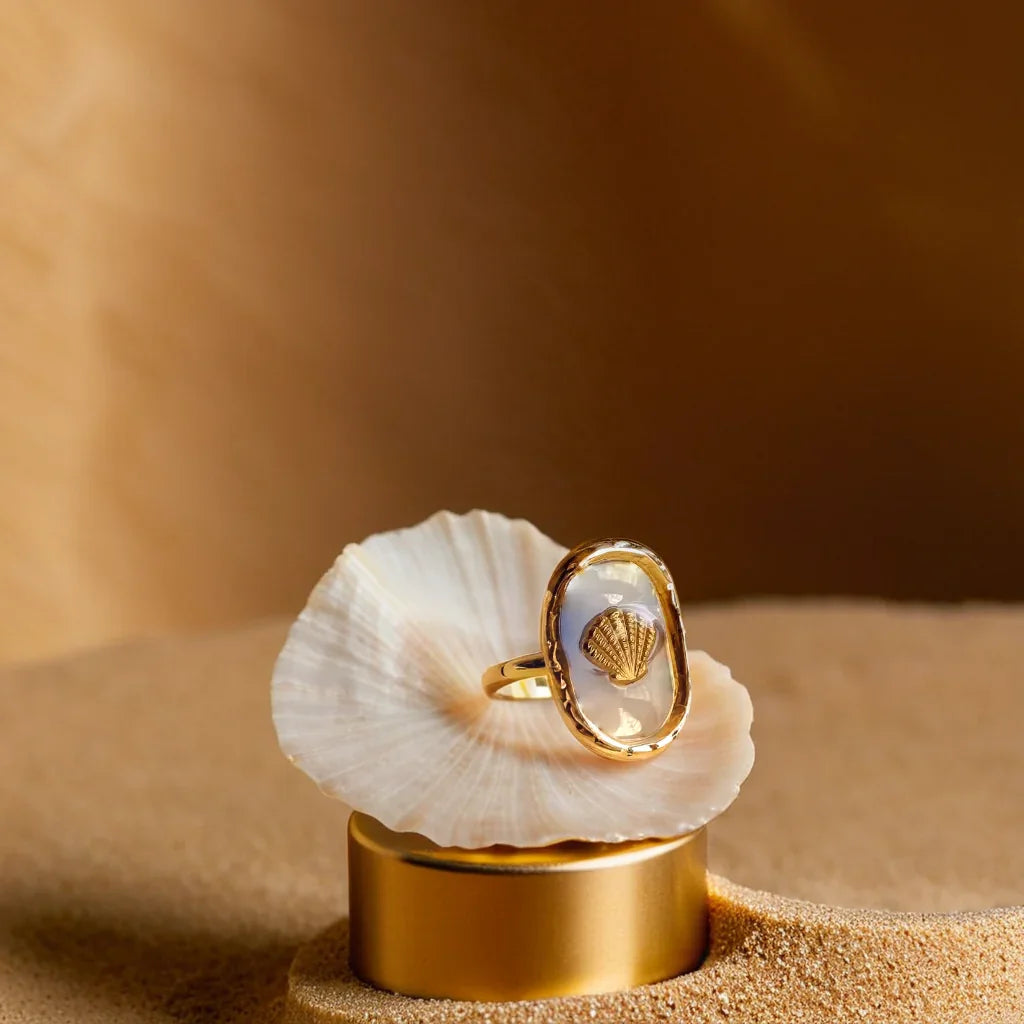 Close-up of women gold ring with hammered seashell design – Éclat Océan Doré
Side angle showcasing adjustable gold band ring for women with 18k plating
Lifestyle image of women gold ring with seashell motif, worn with casual outfit
Detailed shot of gold bands for women with ocean-inspired texture