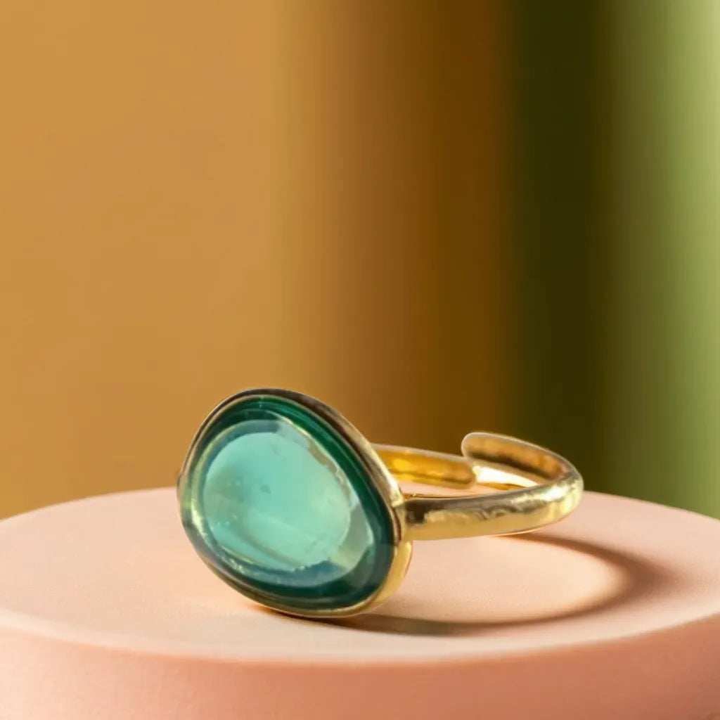 Woman Gold Ring – Bague Azur Mystique | Blue Translucent Design
Capture summer elegance with this woman gold ring featuring a dreamy blue translucent detail and 18K gold plating. Refined, romantic, and adjustable.
Woman gold ring with blue translucent center – close-up view
Gold plated ring for woman – dreamy blue and gold combination
Elegant gold ring with blue resin – Parisian jewelry flat lay
Bague Azur Mystique – romantic gold ring on hand with soft lighting