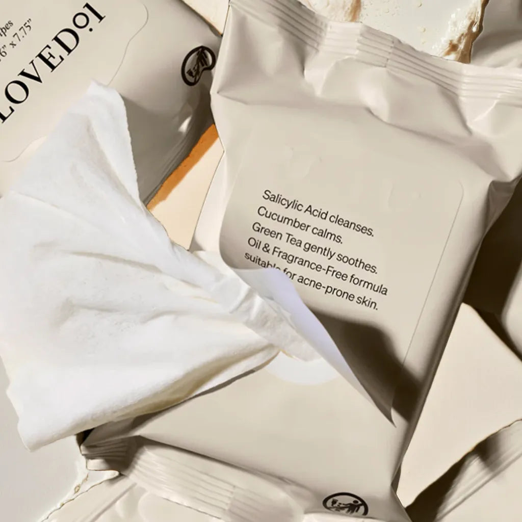 Pack of exfoliating facial wipes – salicylic acid and papaya blend
Woman using face wipe post-gym – refreshing cleanse
Close-up of wipe texture – gentle exfoliation
Flat lay with ingredients – green tea, cucumber, papaya