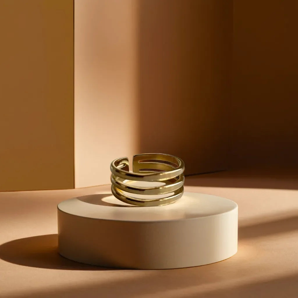 Minimalist gold band ring for women featuring triple-line design close-up
Adjustable gold ring for women with a sleek, modern aesthetic side view
Gold band ring womens style displayed on a model’s hand for scale
Elegant layering of minimalist gold ring with other rings on hand