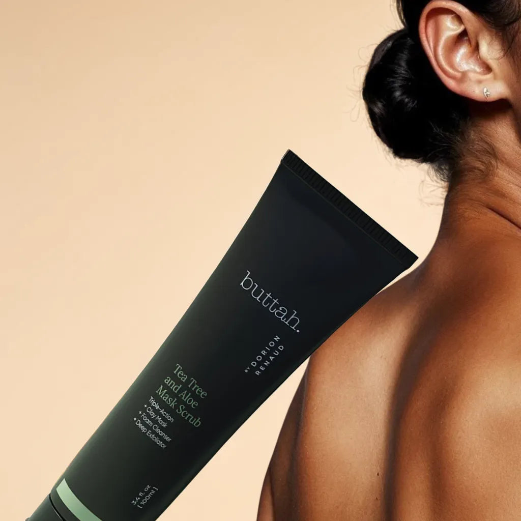 Exfoliating scrub swatched on skin
Mask being rinsed off with water
Flatlay with scrub, tea tree leaves, and aloe
Smooth glowing skin after use