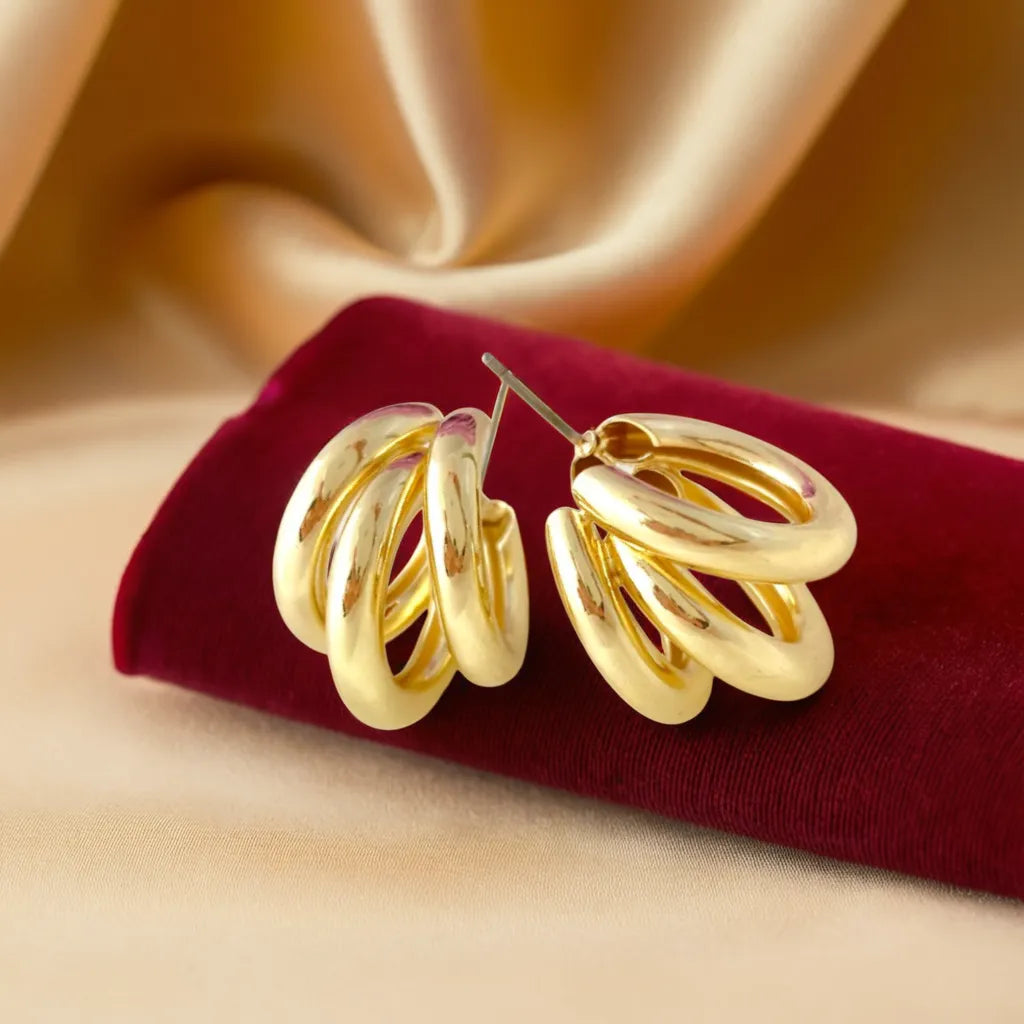 Front view of gold triple band earrings – women gold earrings
Side angle of gold hoops – gold bands for women
Close-up on earring texture – gold band ring womens style
Gold earrings on model – women gold earrings for everyday wear