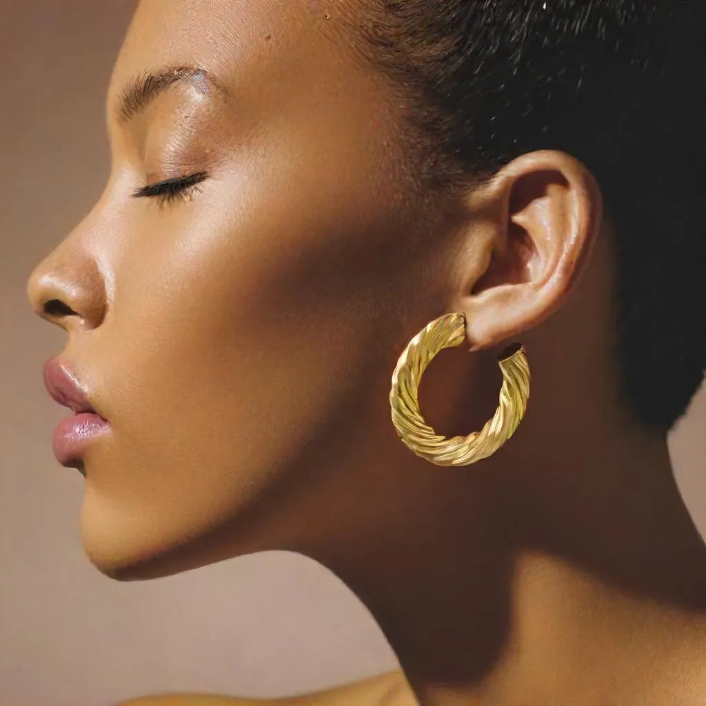 Boucles Impériales – Chunky Gold Hoop Earrings | Radiance Noire
Make a statement with Boucles Impériales – bold yet lightweight gold chunky hoop earrings for women. Elegant, hypoallergenic, and irresistibly Parisian.
chunky gold hoop earrings for women – Boucles Impériales
lightweight gold earrings – close-up of thick Parisian hoops
statement earrings gold – front view of Boucles Impériales on modela
