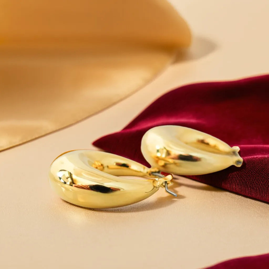 Boucles Impériales – Chunky Gold Hoop Earrings | Radiance Noire
Make a statement with Boucles Impériales – bold yet lightweight gold chunky hoop earrings for women. Elegant, hypoallergenic, and irresistibly Parisian.
chunky gold hoop earrings for women – Boucles Impériales
lightweight gold earrings – close-up of thick Parisian hoops
statement earrings gold – front view of Boucles Impériales on model