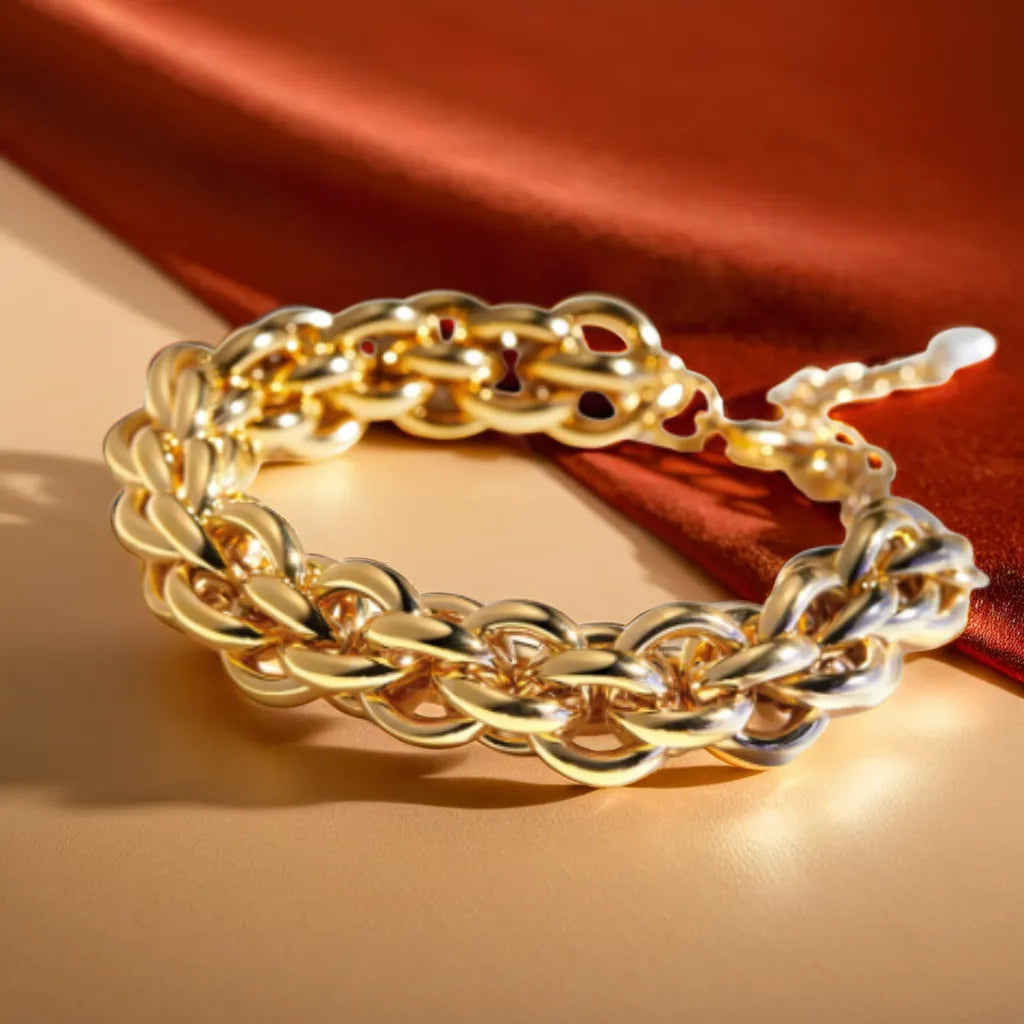 Chaîne Impériale – 18K Gold Bracelet for Women | Radiant & Durable
Bold & elegant, the Chaîne Impériale is a gold plated bracelet for women with 18K shine. Hypoallergenic & adjustable. Parisian luxury—shop now.
Bold gold bracelet for women with 18K plating on neutral background
Close-up of thick 14mm gold plated bracelet with lobster clasp
Woman wearing adjustable 18K gold bracelet – elegant wrist styling
