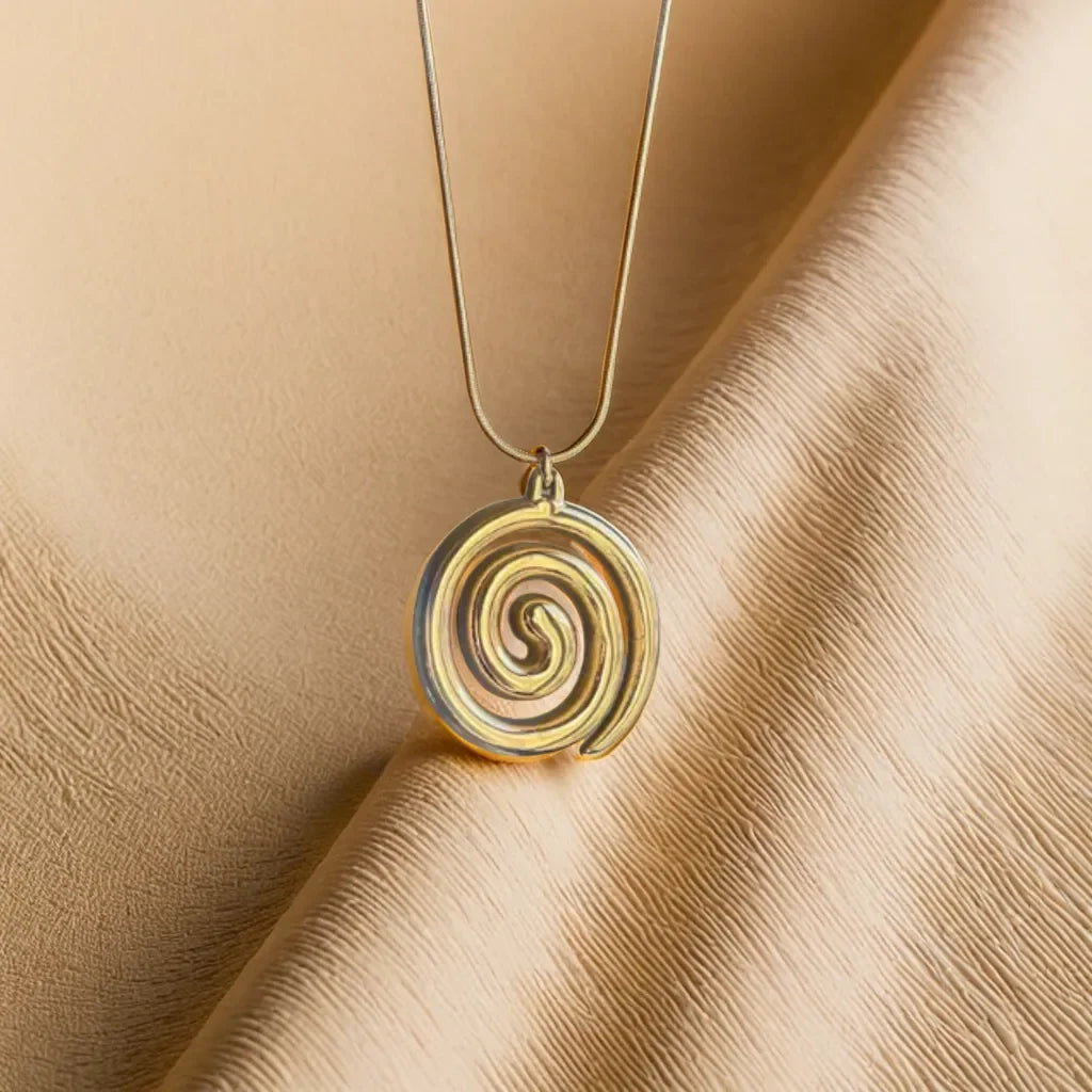 Collier Charme Spirale – Spiral Pendant Necklace | Radiance Noire
Discover the elegance of the Collier Charme Spirale, an 18k gold-plated necklace featuring a minimalist spiral charm. A timeless accessory symbolizing grace and growth.
Gold spiral pendant necklace
Collier spirale plaqué or pour femme
Minimalist spiral charm necklace
Elegant gold necklace with adjustable chain