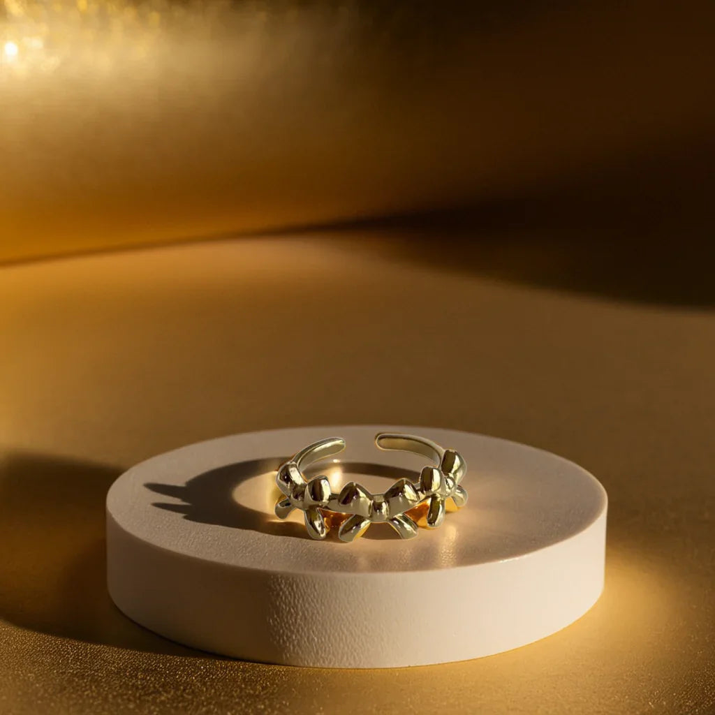 Gold bow ring with delicate triple-knot design close-up view
Adjustable bow ring shown on hand for sizing reference
Gold ring for women styled with other rings for a layered look
Elegant gold bow ring detail highlighting the 18k plating