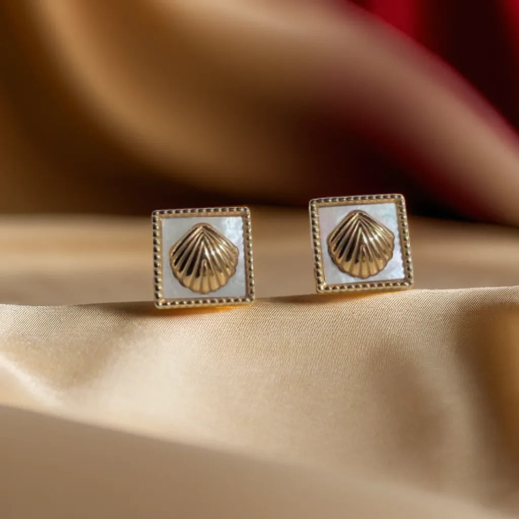 Women Gold Earrings with Mother of Pearl – Éclat Perlé Doré
Add elegance with women gold earrings featuring mother of pearl. Lightweight, tarnish-resistant, and perfect for ocean-inspired sophistication.
Square mother of pearl gold earrings on neutral background – women gold earrings
Close-up of mother of pearl detail – gold earrings for woman
Side view showing gold-plated frame – elegant earrings for women
Styled model wearing pearl gold earrings – feminine and coastal chic look