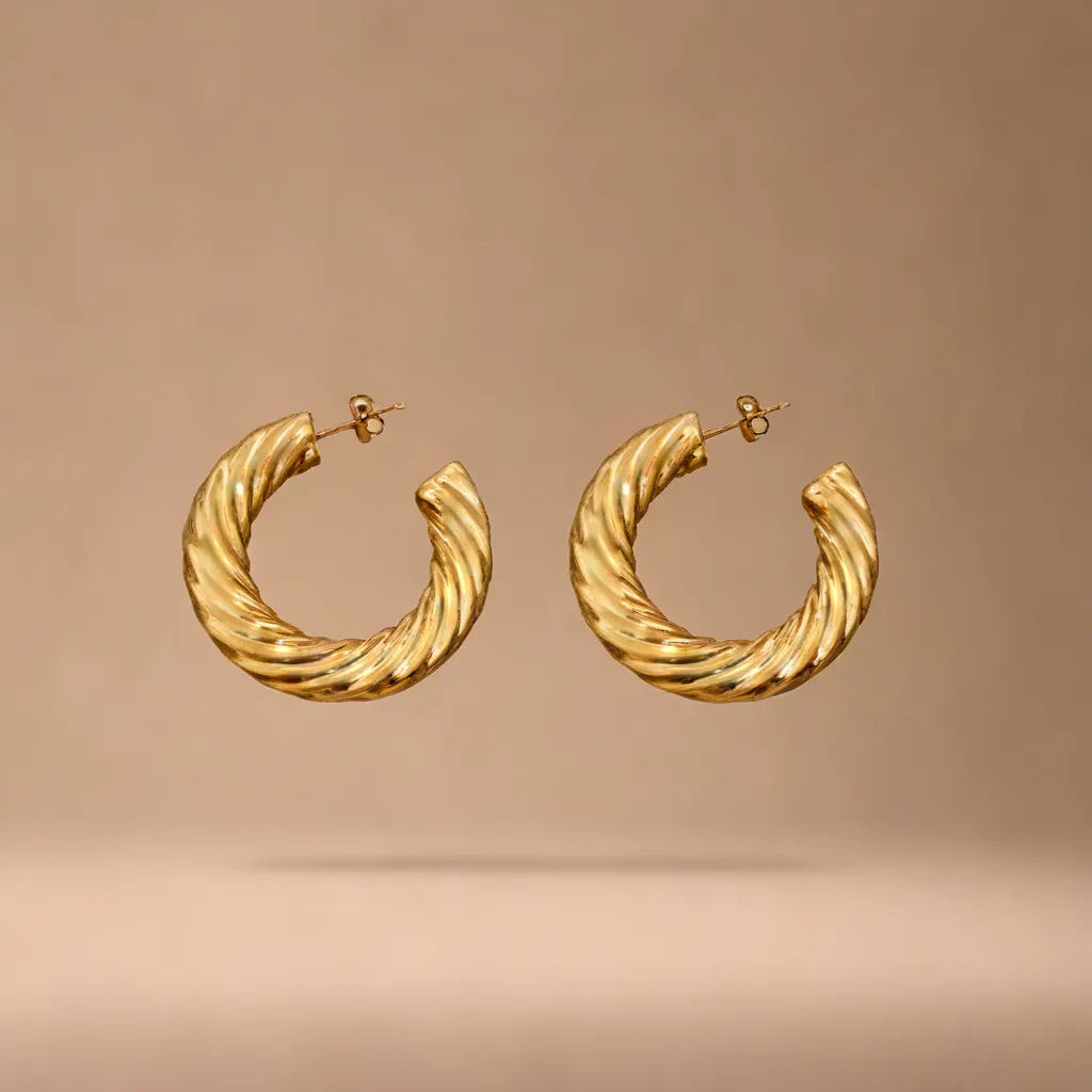 Boucles Impériales – Chunky Gold Hoop Earrings | Radiance Noire
Make a statement with Boucles Impériales – bold yet lightweight gold chunky hoop earrings for women. Elegant, hypoallergenic, and irresistibly Parisian.
chunky gold hoop earrings for women – Boucles Impériales
lightweight gold earrings – close-up of thick Parisian hoops
statement earrings gold – front view of Boucles Impériales on modela
