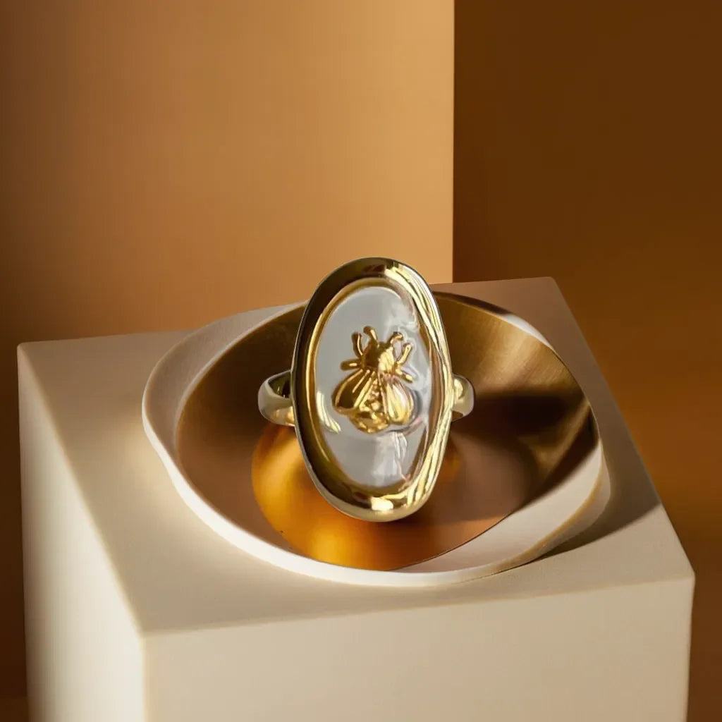 Transparent bee gold ring for women
Golden bee motif ring with adjustable fit
Elegant nature-inspired gold ring
Radiance Noire’s delicate bee design ring