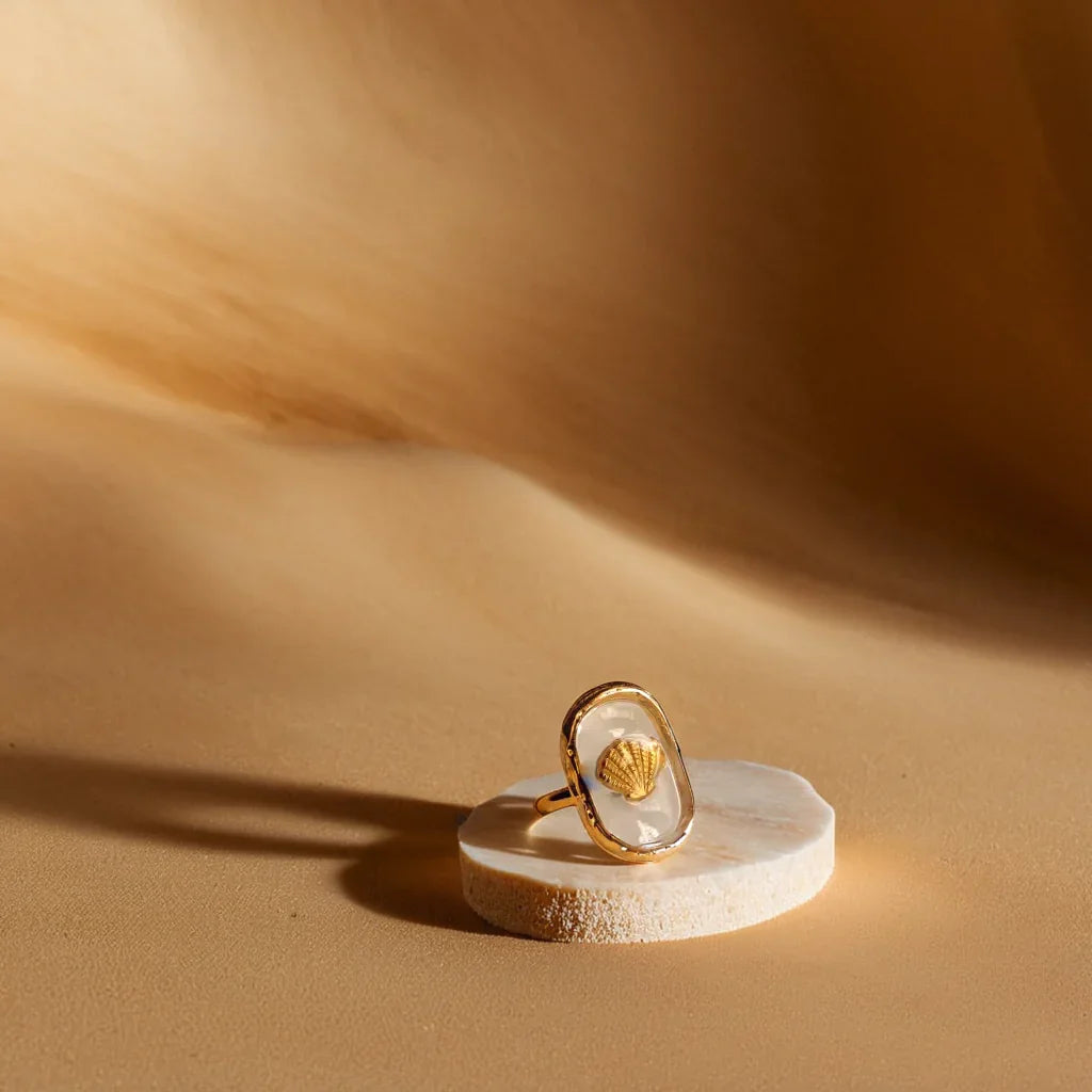 Close-up of women gold ring with hammered seashell design – Éclat Océan Doré
Side angle showcasing adjustable gold band ring for women with 18k plating
Lifestyle image of women gold ring with seashell motif, worn with casual outfit
Detailed shot of gold bands for women with ocean-inspired texture