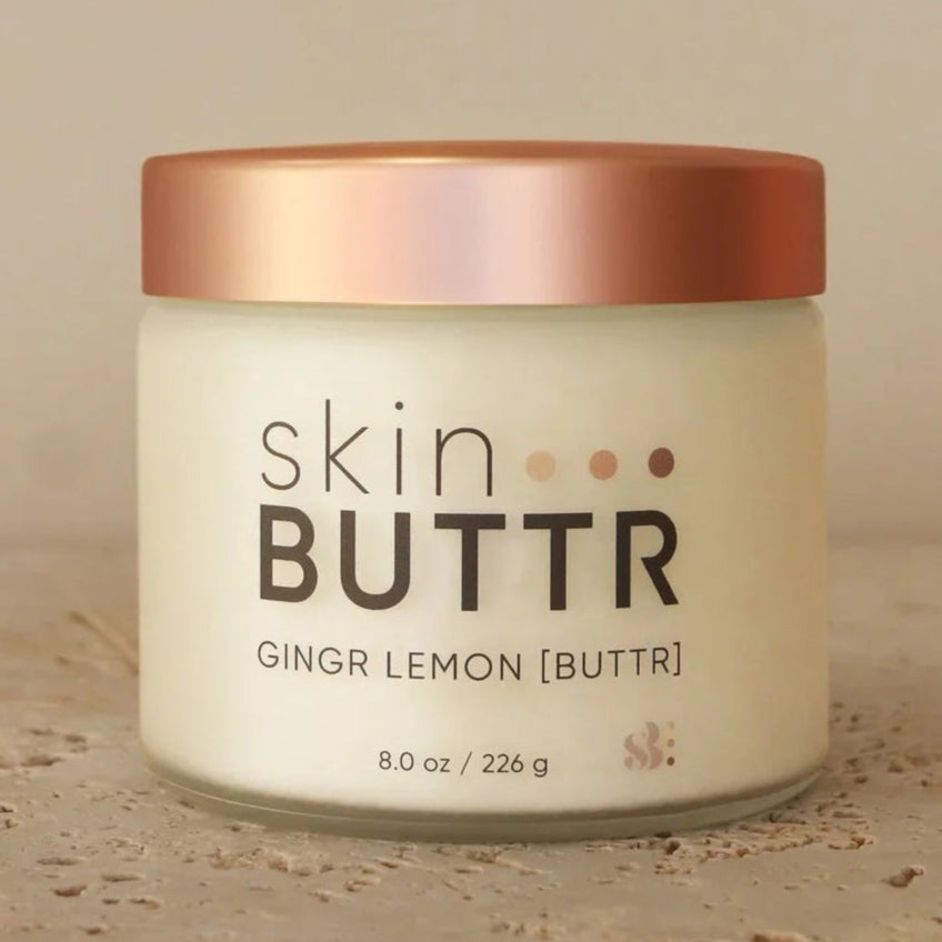 Ginger Lemon BUTTR in glass jar – natural citrus body butter
Texture of whipped shea butter – natural lotion with lemon and ginger scent
Applying Ginger Lemon BUTTR on skin – non toxic body lotion for glowing skin
Skincare flat lay with scrub & BUTTR – best natural body lotion pairing