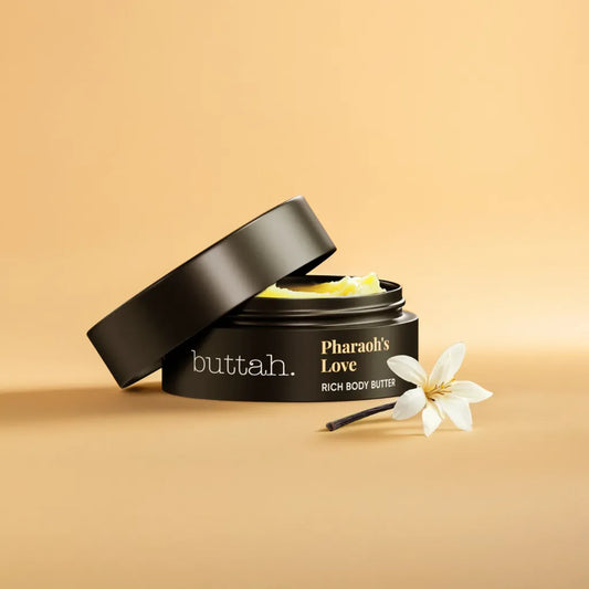 Mini whipped body butter jar – Pharaoh’s Love scent
Swatch of body butter – creamy texture
Travel-size shea body butter on neutral background
Amber and vanilla-inspired body care flat lay

