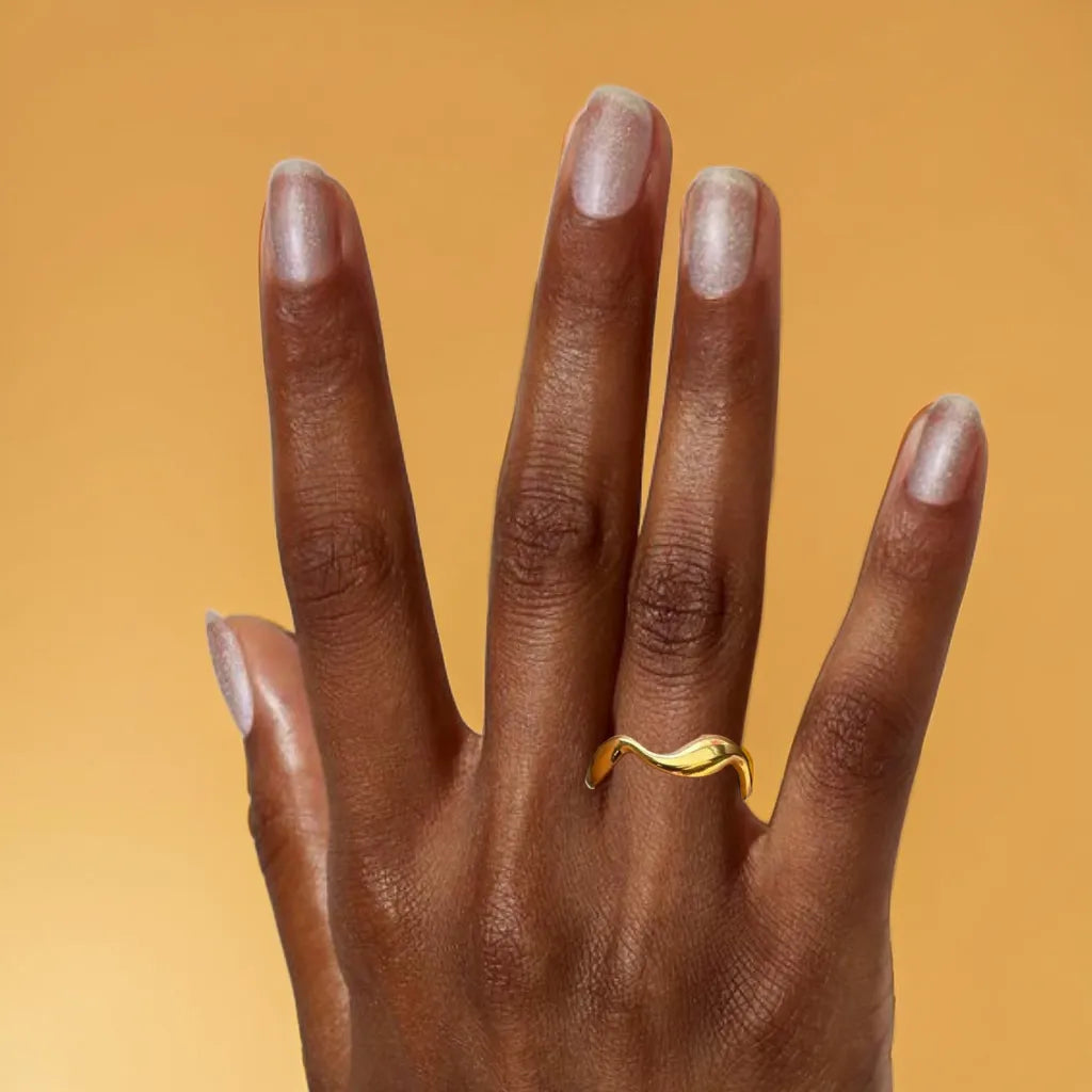 Gold Wave Ring for Women – Anneau Vague Dorée | Radiance Noire

Elegant gold wave ring for women in 18K gold plated stainless steel. Adjustable fit, modern silhouette—perfect for stacking or wearing solo with chic sophistication.

Wave-shaped gold ring for women – close-up
Elegant fluid gold ring with adjustable fit
18K gold plated minimalist wave ring
Anneau doré vague – design moderne et raffiné
