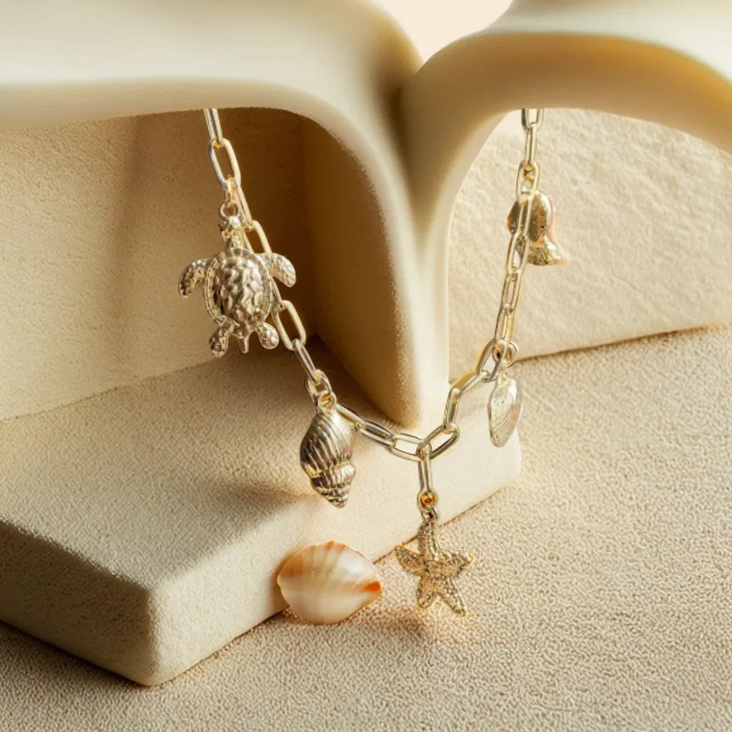 Collier Charme Océanique – Gold Ocean Necklace | Radiance Noire

Elevate your style with this 18k gold-plated ocean charm necklace. Featuring seashell and coastal accents, it’s a refined, beach-inspired statement for women who love the sea.

Gold ocean charm necklace
Collier coquillage femme plaqué or
Beach-inspired necklace for women
Ocean-themed gold jewelry piece