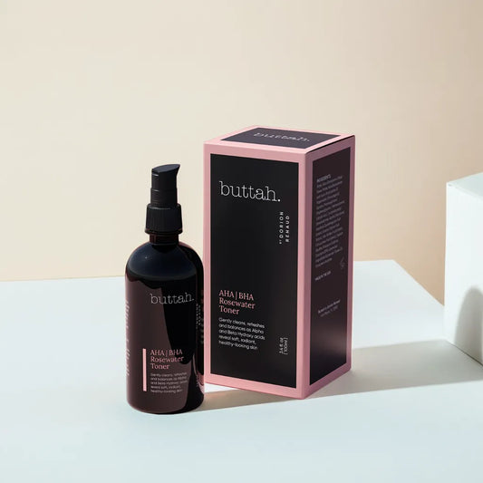 Rosewater toner bottle with dewy droplets
Toner and rose petals styled on a bathroom tray
Pouring toner onto cotton pad
Woman patting toner into glowing skin
