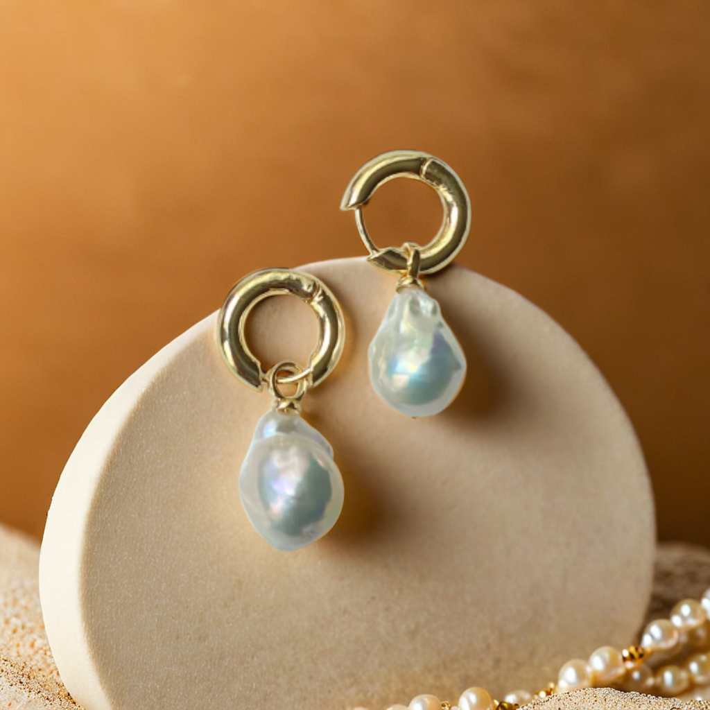 Women Pearl Earrings with Baroque Charms | Boucles Lumière d’Océan
Elegant women pearl earrings with detachable baroque charms. Versatile 3-in-1 design for everyday wear, chic soirées, or necklace pairing.

Women pearl earrings – baroque charm detachable design
Gold earrings with removable pearl pendants – front view
Detachable baroque pearl charms – flat lay detail
Boucles Lumière d’Océa – earrings styled as necklace charms