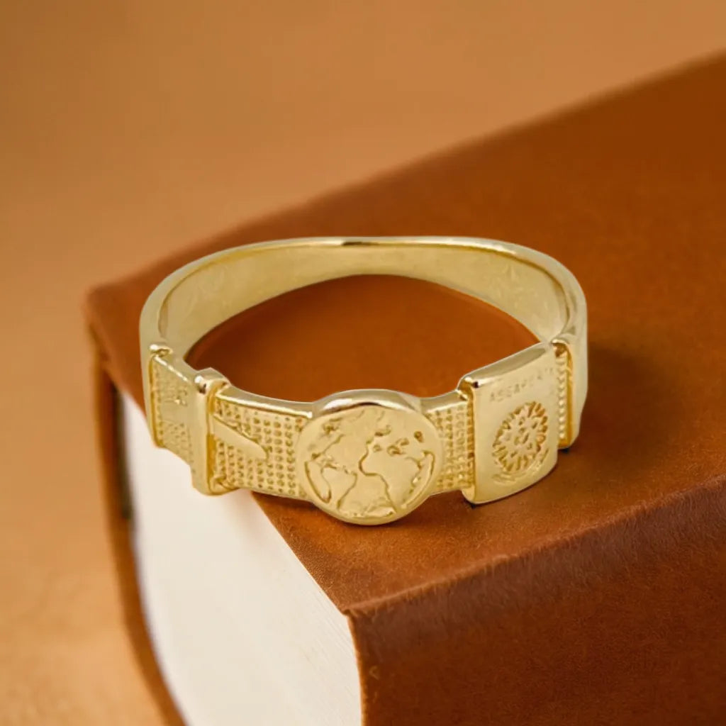 Women Gold Ring – Anneau Voyageur by Radiance Noire
Celebrate your journey with this women gold ring. Shop Anneau Voyageur—engraved, elegant, and water-resistant. A golden ode to dreamers & travelers.
Women gold ring flat lay with travel-themed engravings
Close-up of gold band ring womens with passport and globe motifs
Model wearing women gold ring showing engraved travel icons