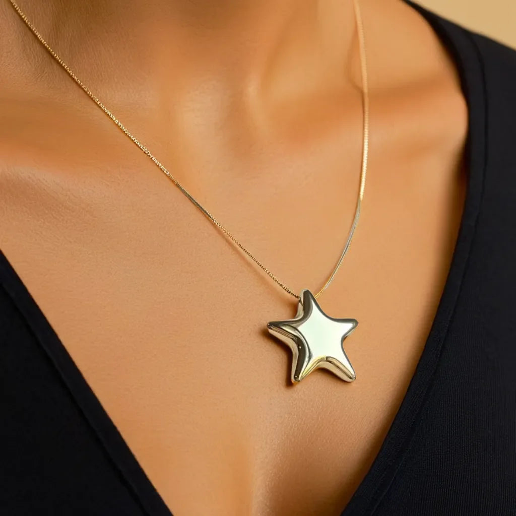 Chunky gold star necklace with bold celestial motif
Celestial necklace styled as a choker for a dramatic look
Gold star choker highlighting the radiant 18k gold plating
Chunky celestial necklace layered with other gold chains