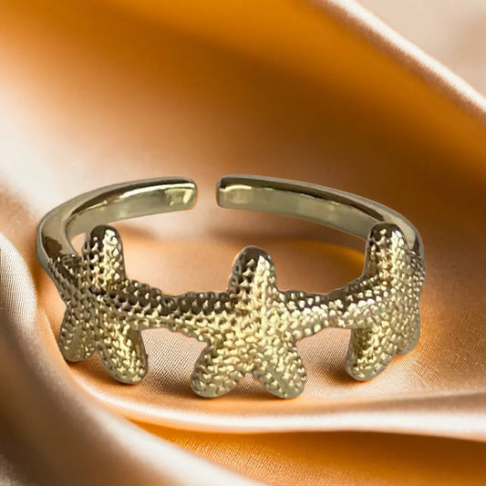 “Ocean Muse Ring – 18k gold plated adjustable women’s starfish ring”
“Gold plated starfish ring for women – Ocean Muse side view”
“Adjustable mini starfish gold ring – Ocean Muse jewelry detail”
“Women’s gold ring inspired by ocean starfish – worn on hand”