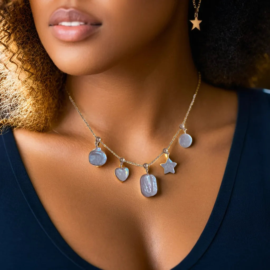 Star and pearl necklace with shimmering celestial charms
Celestial necklace styled with detachable star and heart motifs
Gold star pearl necklace with layered styling options
Star and pearl necklace showing intricate gold detailing