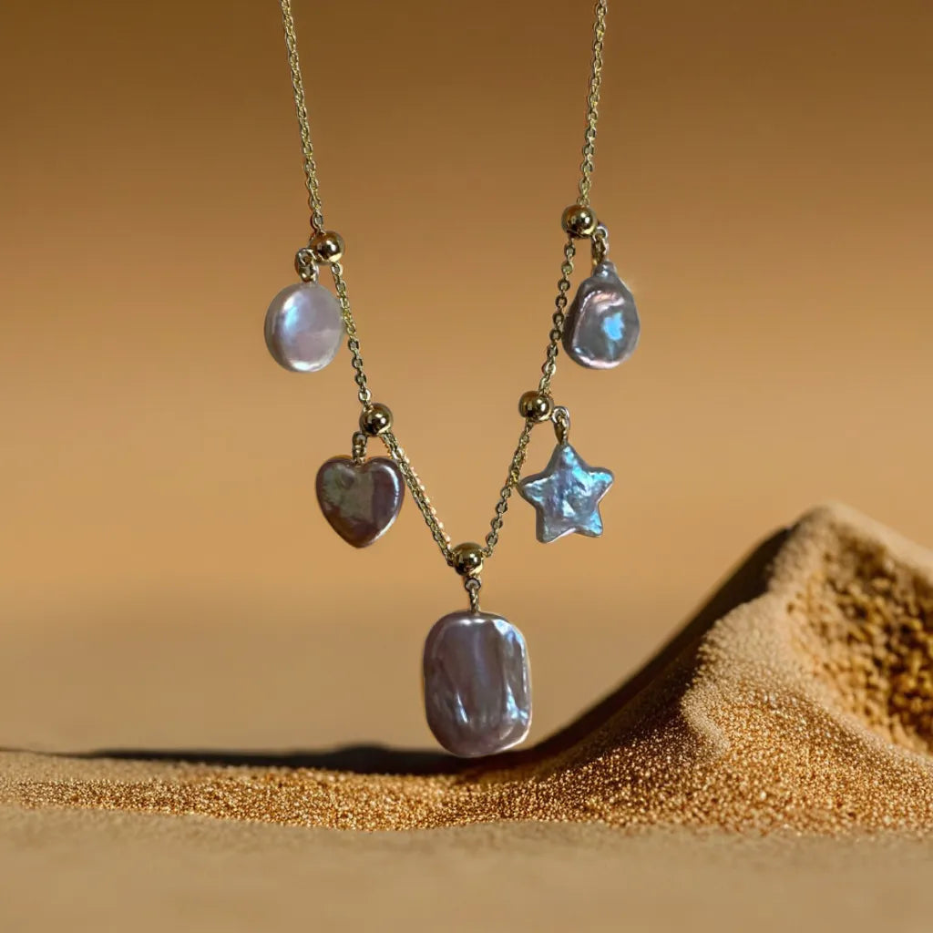 Star and pearl necklace with shimmering celestial charms
Celestial necklace styled with detachable star and heart motifs
Gold star pearl necklace with layered styling options
Star and pearl necklace showing intricate gold detailing