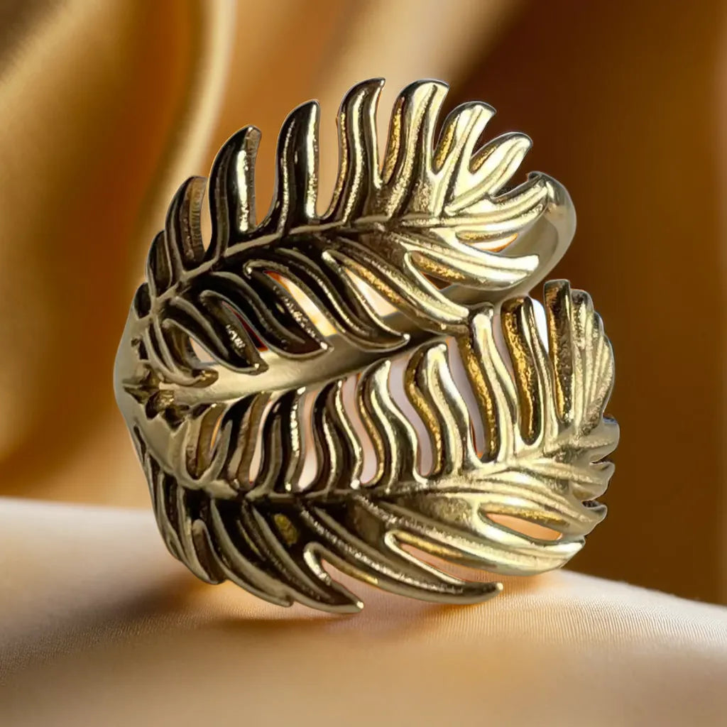 “Palm Leaf Gold Ring – 18k gold plated adjustable ring for women”
“Tropical palm leaf gold ring – close-up design”
“Women’s gold ring – 18k gold plated palm leaf motif”
“Adjustable gold ring for women – tropical jewelry piece”